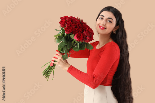 Happy young woman with bouq...