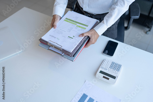 Фотография Businessman holding a lot of documents paper work concept