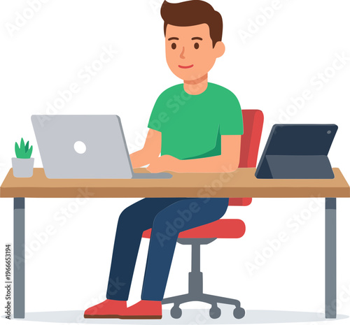 Man works on laptop at desk with tablet and plant nearby indoors