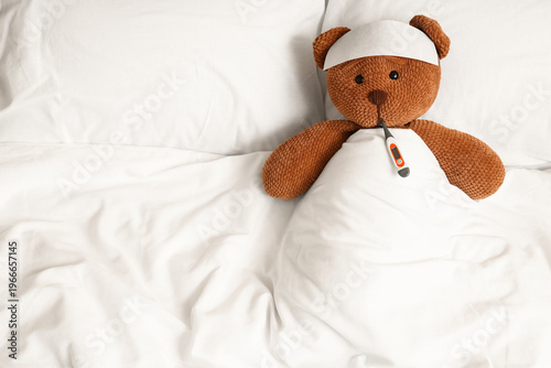 Toy bear with thermometer i...