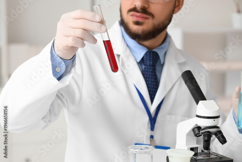 Male scientist with test tu...