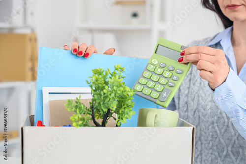 Fired businesswoman packing...