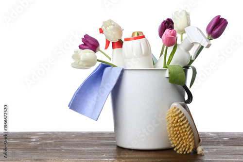 Bucket with bottles of dete...