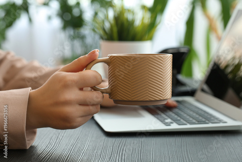 Businesswoman with coffee c...
