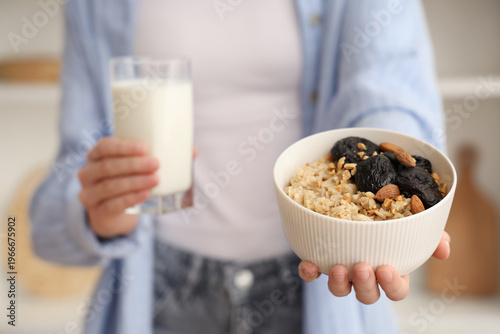 Woman holding bowl of tasty...