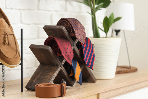 Stand with neckties on shel...