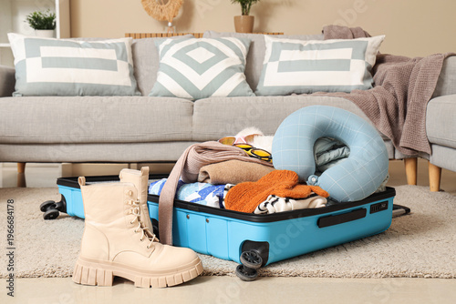 Suitcase with belongings on...