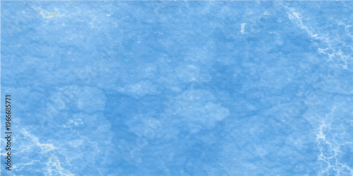 A captivating and serene high-angle shot showcasing a light blue, textured marble surface, offering a sense of artistic refinement.