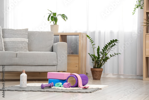 Sports equipment on mat in ...