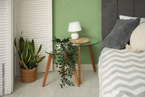Glass bedside table with la...