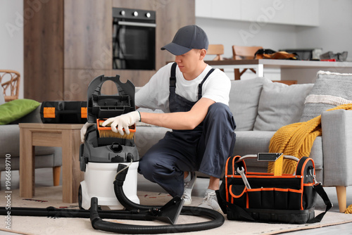 Male technician repairing v...