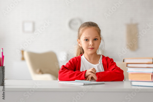 Cute little girl with books...
