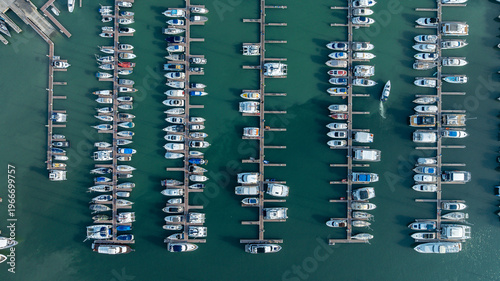 Aerial view of colorful yatch boats, Summer seascape with ships, sunny day. Top view, yachts from flying drone, Aerial view directly above of Yatchs moored at the quay.