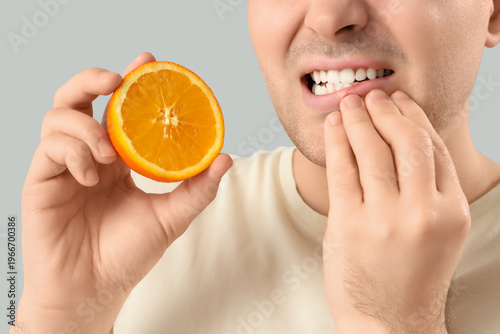 Young man with orange suffe...