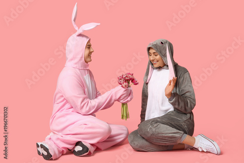 Couple in bunny costumes wi...