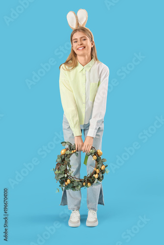 Young woman in bunny ears w...