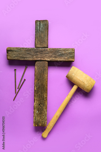 Wooden cross with hammer an...