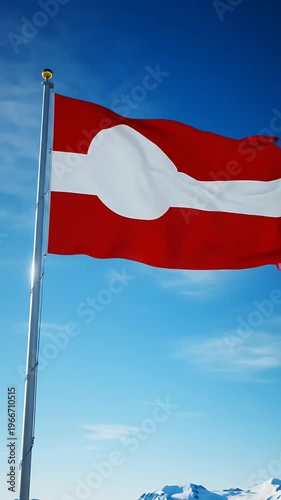 Greenland Flag Waving Against Clear Blue Sky and Snowy Mountains
