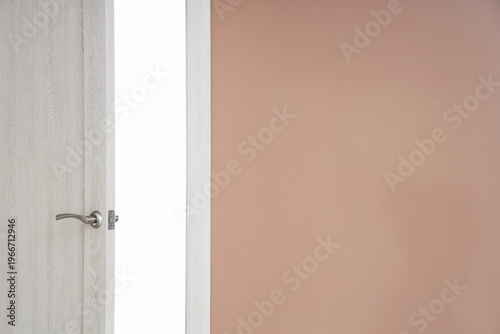 Open wooden door in hotel room