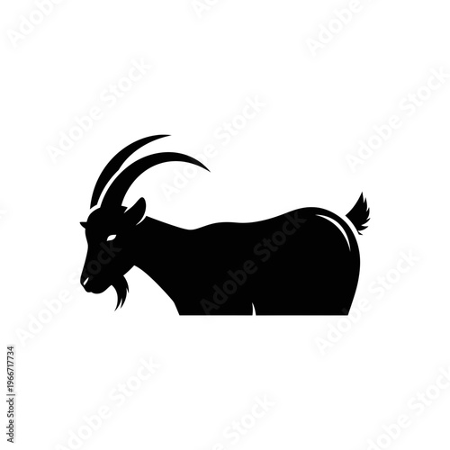 Black silhouette of a goat with large curved horns and a beard, standing sideways on a white background, depicting a strong and wild animal.