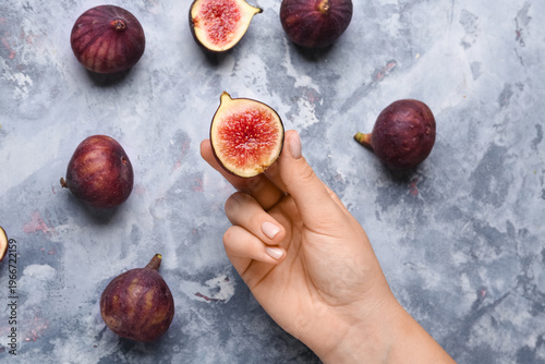 Woman holding half of fresh...