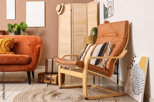 Orange sofa and armchair wi...