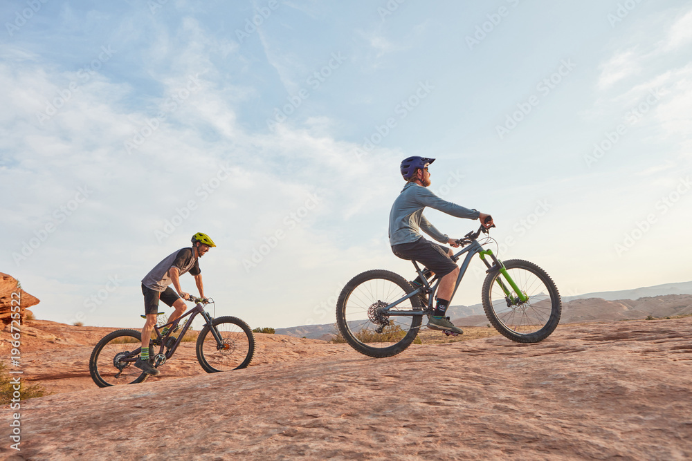 Obraz premium People, exercise and cycling in nature with mountain bike, adventure and training together for fitness. Space, friends and countryside journey with bicycle, helmet and outdoor workout for wellness.