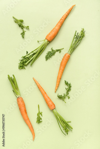 Fresh carrots on light gree...