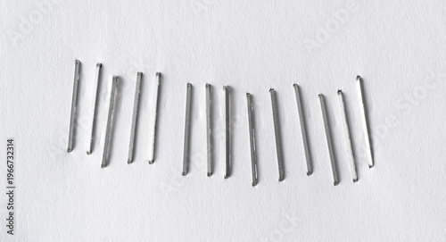 Staples pushed into a paper, metal office staple needles