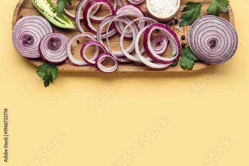 Board with fresh onion slic...