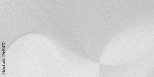 Fotografi A close-up of two white objects on a gray surface