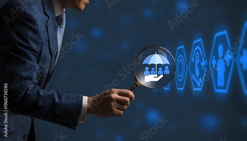 Asian businessman holding a magnifying glass over a glowing blue icon representing an umbrella protecting family, symbolizing security and insurance. Modern digital corporate background.