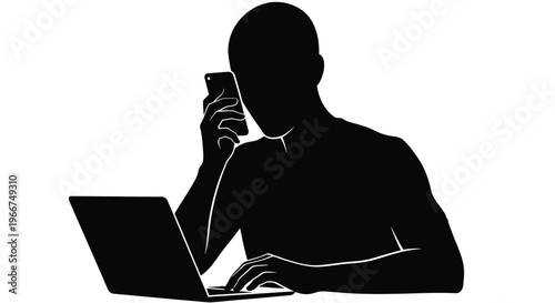 Man working on laptop while talking on phone in modern workspace setting with technology