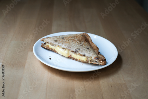 Homemade sandwich cheese and tuna on the white plate.