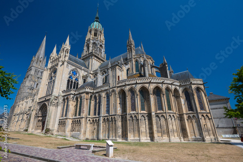 Gothic facade of Bayeux Cathedral under blue sky Normandy