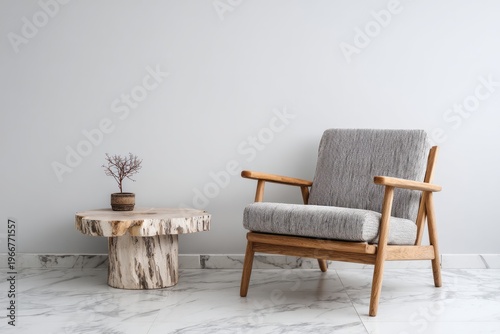 Wooden armchair and live edge table with plant create a minimalist interior.