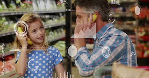 Playing dad and daughter holding banana phones in produce aisle, wearing blue patterns, HUD