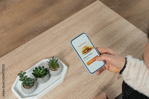 Fotografie Individual ordering food delivery using mobile application on phone