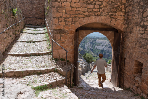 Bild auf Leinwand Tourist strolling through the Medieval Village of Alquezar