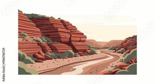 A winding dry riverbed cuts through a canyon with layered red rock formations