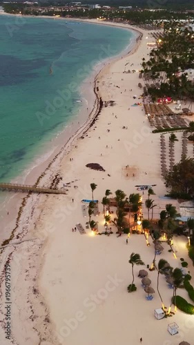 Popular tourist coastline at dusk, city lights