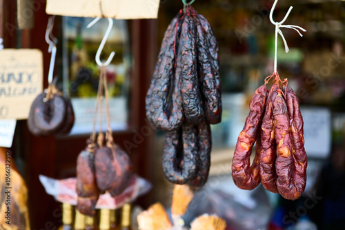 Sausage stall. Ponte de Lima (Portugal), March 30, 2026. Shop selling typical sausages from northern Portugal, hams, and chorizos, generally sold smoked.
