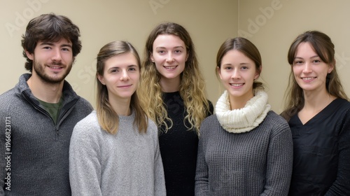 Young Adult Group Portrait: A group of five youthful individuals, diverse in appearance, stands united, fostering a sense of camaraderie, embodying the spirit of youthful togetherness.