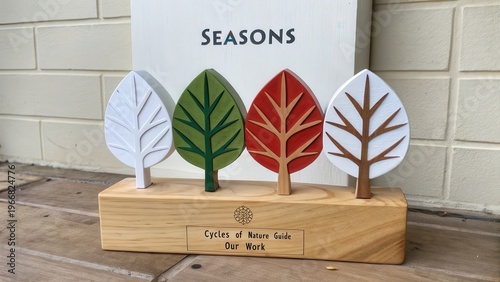 Four Seasonal Trees Displayed on Wooden Base