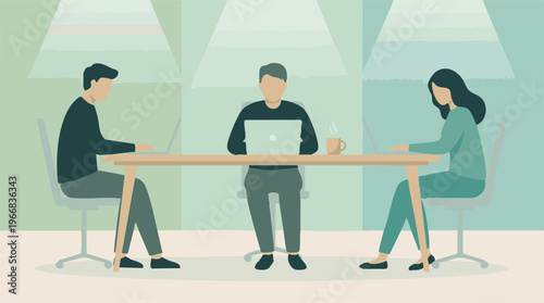 People working on laptops at a shared table in a modern office setting.