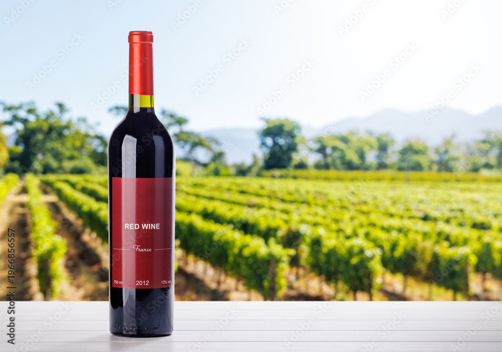 Fototapeta premium Wine bottle mockup in sunlit vineyard