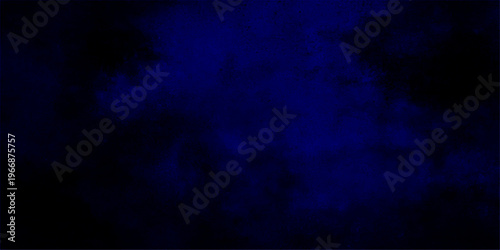 Abstract a dark night sky with deep blue and black abstract. A sense of mystery and depth is conveyed.