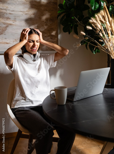 Exhausted woman feeling overwhelmed and frustrated with remote work and digital overload