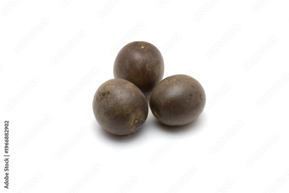 Fototapeta premium Three Whole Ripe Passion Fruits Isolated On White Background