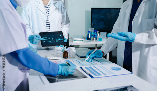 Professional female doctor using futuristic AI digital interface for patient health monitoring and diagnostic analysis in laboratory